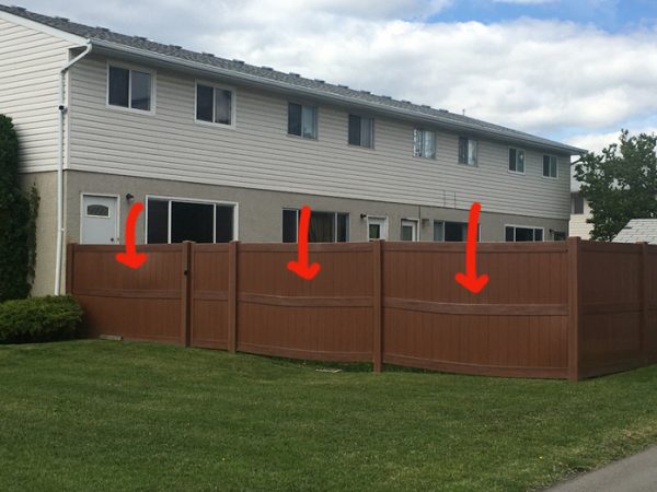 Image of Vinyl fence bowing and sagging